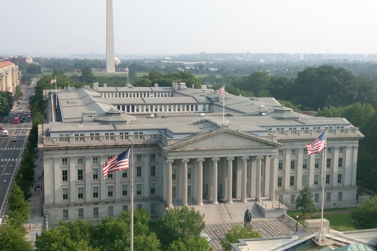 U.S. Treasury building in Washington, D.C., with the Washington Monument behind it